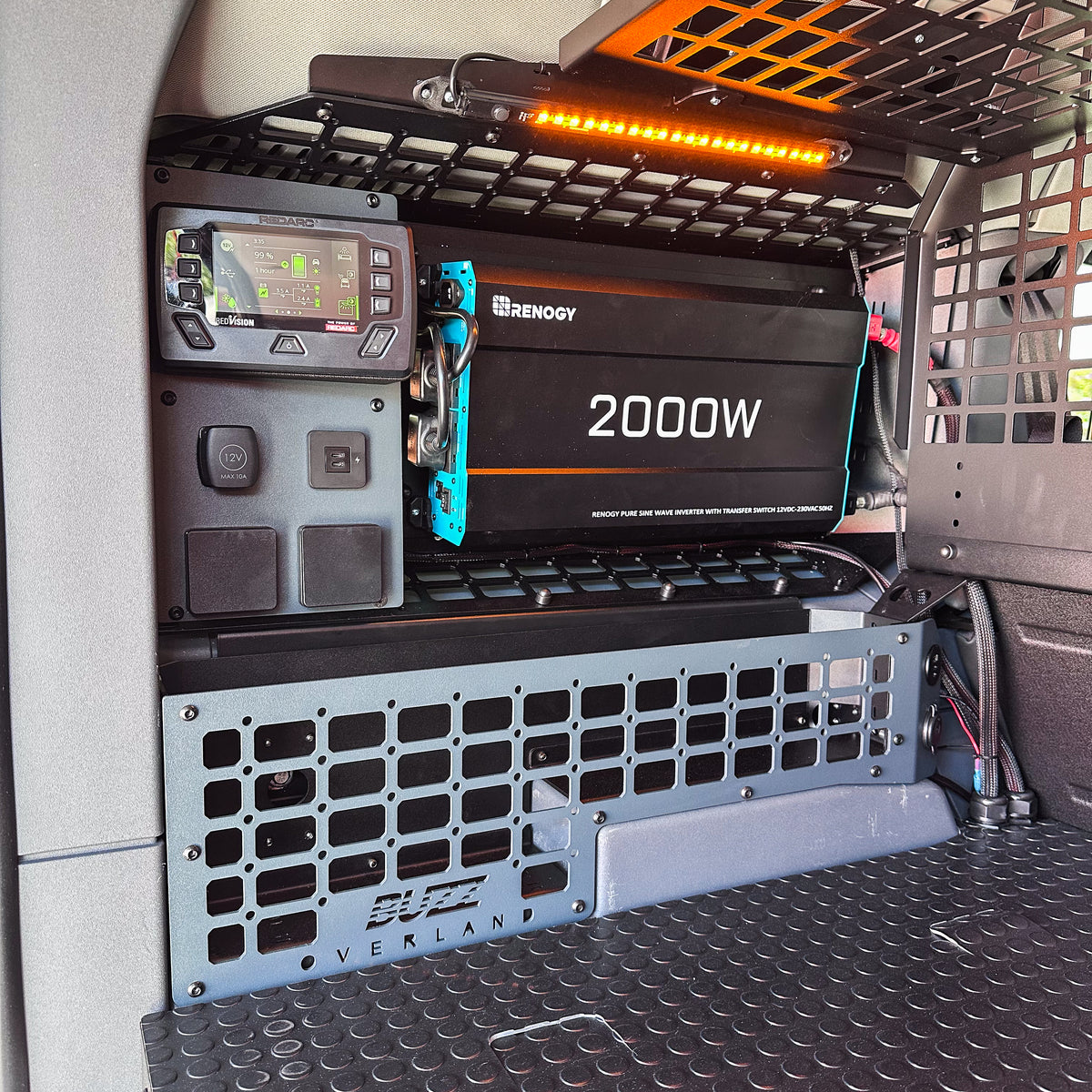 Buzz Overland rear window MOLLE panel with REDARC Power Plate and RedVision display in an INEOS Grenadier
