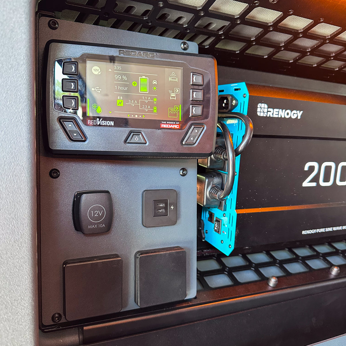 REDARC RedVision touchscreen on the Buzz Overland power plate, INEOS Grenadier rear window MOLLE panel