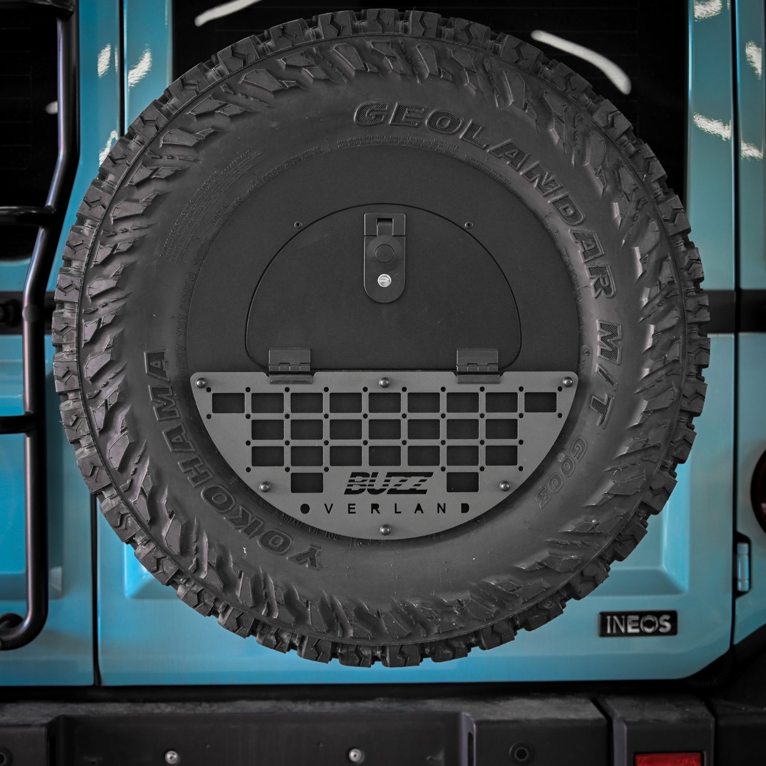Close-up of lockable Buzz Overland Spare Wheel Storage Cubby for INEOS Grenadier, featuring corrosion-resistant 5052 aluminium and secure storage for off-road gear.