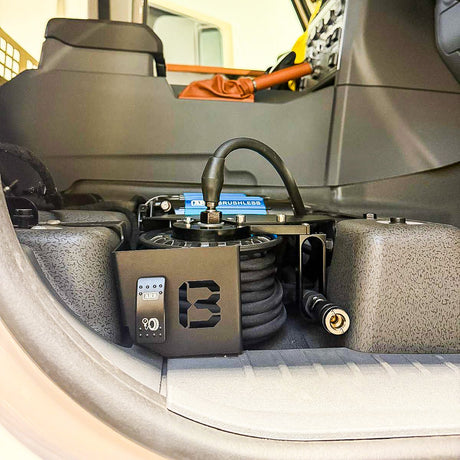 INEOS Grenadier under-seat ARB compressor mount with 10m retractable air reel by Buzz Overland (Brushless shown)